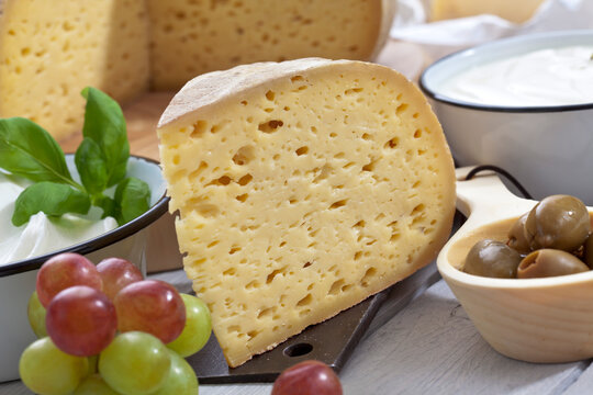 Bethmale cheese, with grapes and olives, close up
