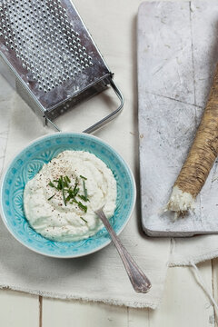 Bowl of Horseraddish sauce, horseraddish and grater