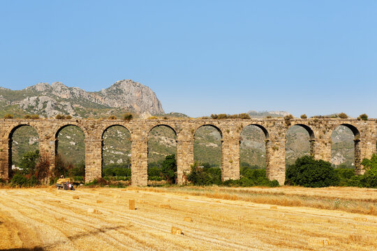 Turkey, Serik, ancient town Aspendos, Aqueduct and stubble field