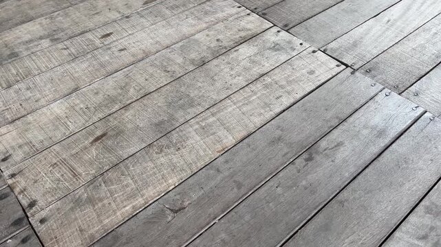 Close up of weathered wooden floor planks texture