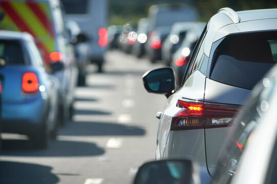 Traffic jam congestion with rows of cars on highway or motorway in rush hour