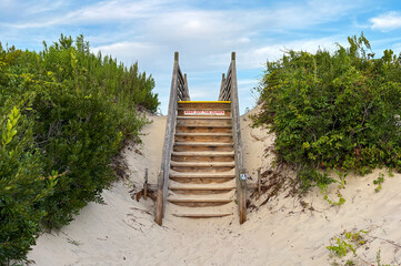 Fototapeta premium Steps Leading to a Beach in Corolla North Carolina With Clear Sky
