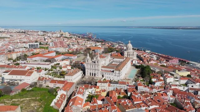 Slow panoramic drone pan of National Pantheon, Lisbon at midday. Bright sunny day, clear blue sky. Historic Baroque architecture. Portugal