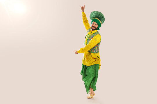 Sikh Man performing bhangra during Baisakhi Celebration