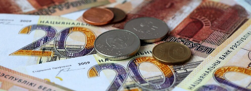 Belarusian ruble money banknotes and coins on table. Belarus cash bills of BYN currency