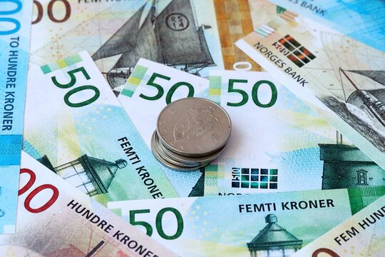 Norwegian krone money banknotes and coins on table. Norway cash bills of NOK currency