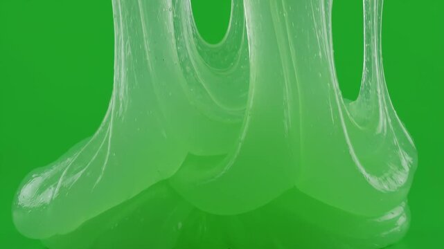 Neon green slime flowing down against green background
