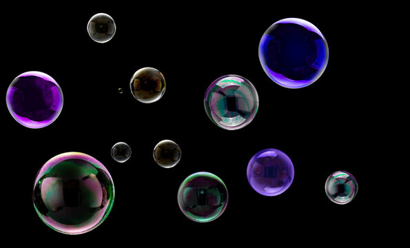 Colorful floating soap bubbles on black background with glossy reflections and iridescent hues