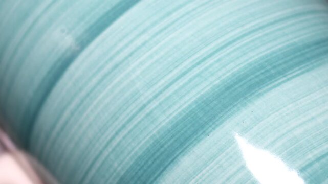 A close-up view of a green bowl, perfect for food or nature . Rotating in a circle