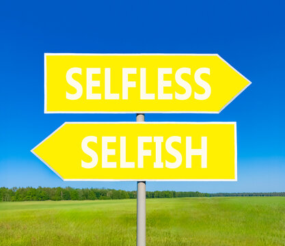 Selfless instead selfish words symbol. Concept words Selfless Selfish on beautiful yellow road sign. Beautiful blue sky background. Business medical psychology selfless selfish concept. Copy space.