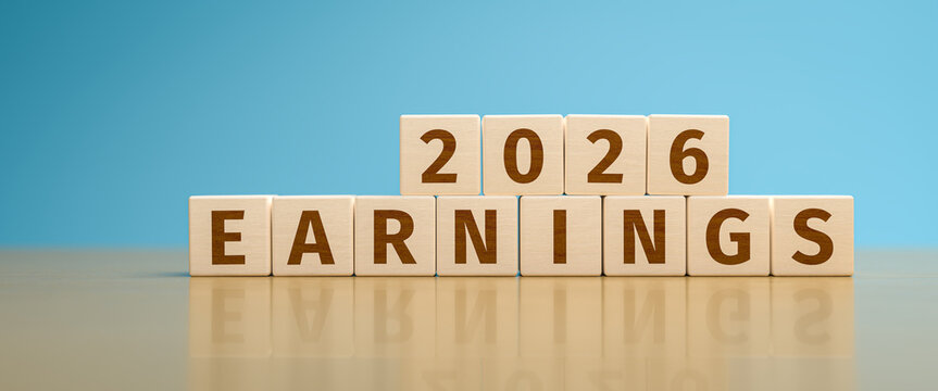 Wooden toy cubes forming the text "2026 EARNINGS". Concept for earnings, revenue reached or planned for the year 2026 of an organisation or company.