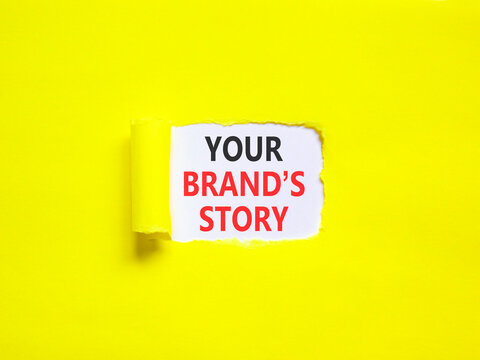 Branding and your brands story symbol. Concept words Your brands story on beautiful white paper. Beautiful yellow paper background. Business branding your brands story concept. Copy space.