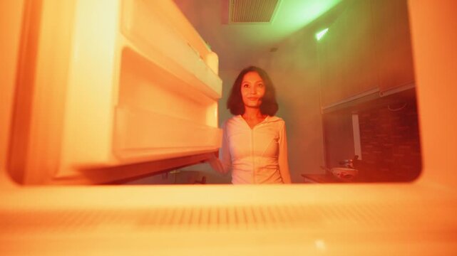 POV inside freezer footage of asian woman opening fridge door with cold vapor steam taking food in kitchen
