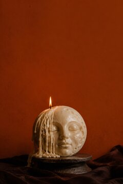 Melting Moon Face Halloween Candle with Copy Space