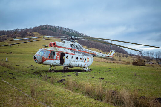 Abandoned Mil Mi-8 helicopter in a grassy field, Bistrita, Romania