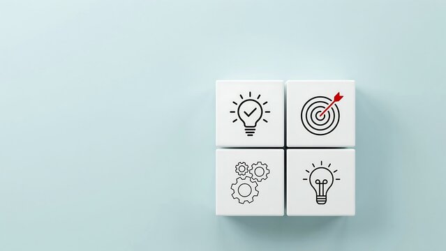 Four white cubes arranged in a 2x2 grid, each displaying a business or strategy related icon. The icons represent an idea with a checkmark, a target with an arrow in the bullseye, gears.