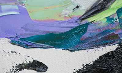 Fototapeta premium Closeup of a painting by oil and palette knife. Highly-textured, high quality details. Fragment of multicolored texture painting. Abstract art background. oil on canvas. Rough brushstrokes of paint.