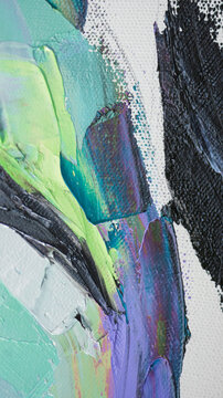 Closeup of a painting by oil and palette knife. Highly-textured, high quality details. Fragment of multicolored texture painting. Abstract art background. oil on canvas. Rough brushstrokes of paint.