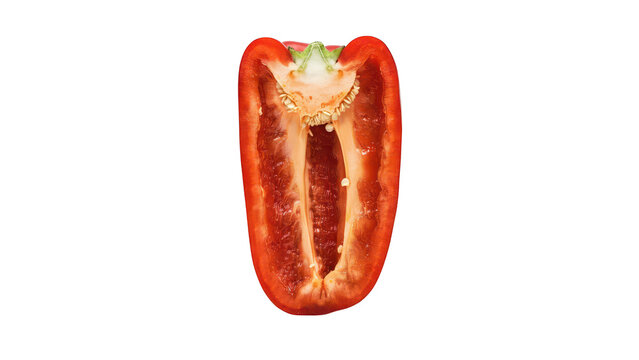 A vertical cross-section of a fresh red bell pepper showing the hollow interior, white pith, and seeds, isolated on a solid black background