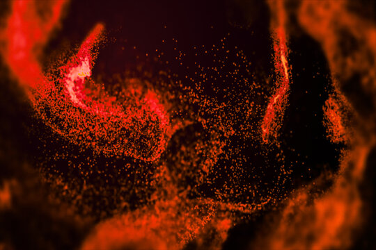 Red and orange glowing particles create a dynamic abstract energy