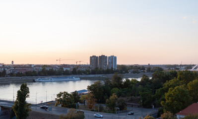 Fototapeta premium High-angle view of the Danube River flowing through Novi Sad, Serbia at sunset