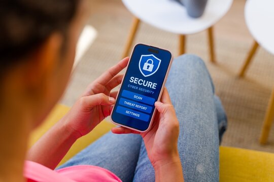 Hispanic Person using a cybersecurity application on a smartphone