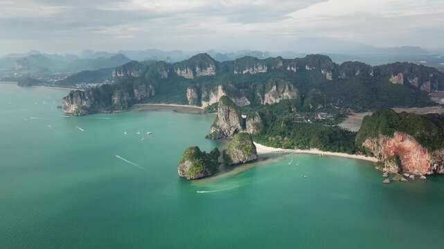 Aerial view of Railay Beach with turquoise water, limestone cliffs, and boats in Ao Nang, Krabi, Thailand.