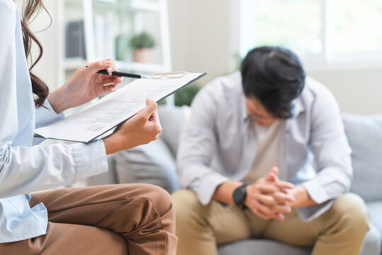 Man talking with mentor psychologist in therapy mental health anxiety session.