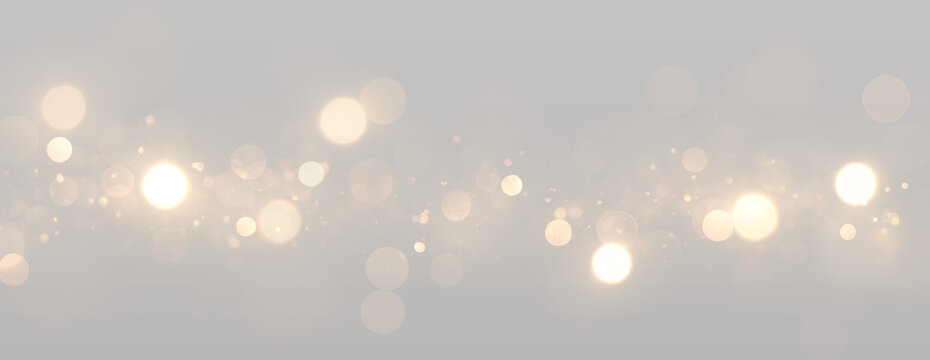Glowing bokeh lights with bright circles and sparkling particles.
