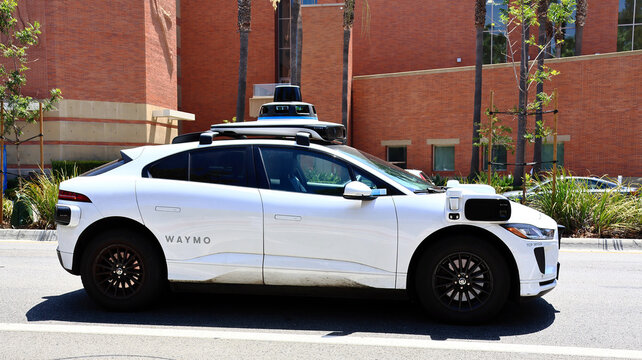 Los Angeles, California &ndash; July 28, 2026: Waymo autonomous self-driving vehicle resuming on the street with driverless seat visible 