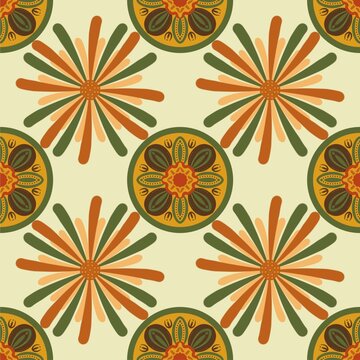 Seamless floral pattern featuring alternating radial flowers and ornate circular floral medallions in olive green, terracotta, golden yellow, and warm orange on a soft cream background