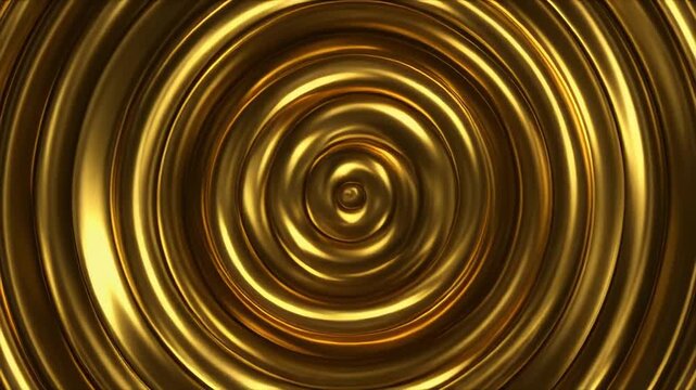 Golden metallic rings expanding in smooth circular motion against dark background with subtle lighting