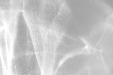 Naklejka premium Real vertical caustic shadow cut out on a transparent png background with soft grainy edges. Suits a serene wellness mockup overlay, a vintage film and analog branding as a transparent png layer.