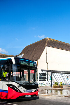 Close Up Cropped Shot Of The Front Of A Falcon Single Decker Bus Driving On A Town Centre Main Road