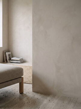 Minimalist empty limewash plaster wall mockup template with travertine tile floor in Japandi interior, editable background presentation for art prints and products with copy space.