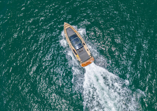 Aerial view motorboat. Yacht boat tour. Luxury boat yachting in summer. Motorboat sailing at sea. Luxury private yacht in sea. Motor yacht luxury vessel. Boat motor aerial. Vacation on summer