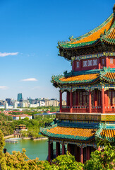 Fototapeta premium Traditional Chinese Tower at Summer Palace Overlooking Beijing Cityscape