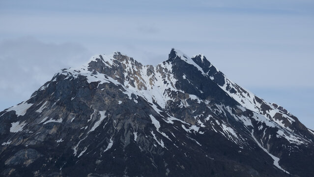 Breathtaking Alaska mountain glacier range view seen from outdoor deck of cruise ship liner sailing the Inside Passage transit with spectacular landscape wilderness scenery