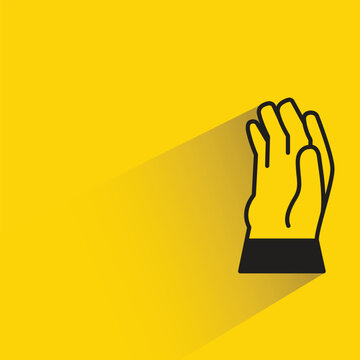 hand glove icon with shadow on yellow background