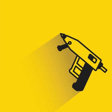 glue gun icon with shadow on yellow background