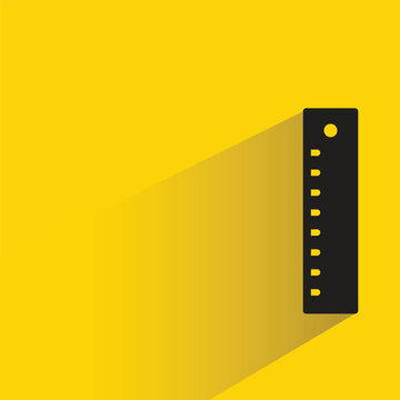 ruler with shadow on yellow background