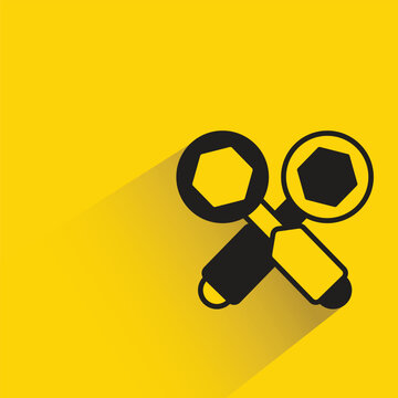 crossed wrench tools icon with shadow on yellow background