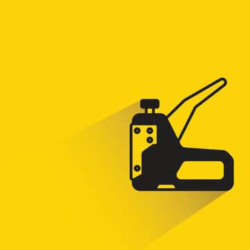 stapler icon with shadow on yellow background