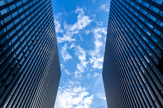 Modern office buildings show futuristic architecture, urbanization and city development with modern glass facades and design office complex with skyscrapers and real estate investment metropolitan
