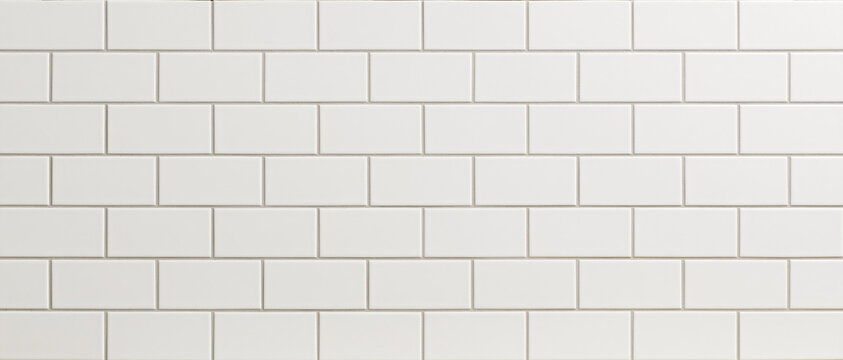 Seamless white subway tile pattern background texture. Clean, modern, and minimalist ceramic surface with light gray grout lines, ideal for kitchen, bathroom, or interior design. A