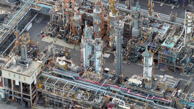 Aerial view of industrial refinery with complex piping and distillation towers in Bantzenheim, Grand Est, France.