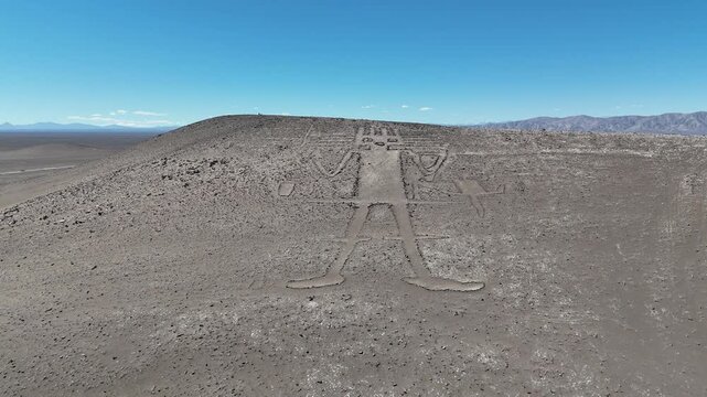 Epic aerial footage of the Atacama Giant, a massive ancient geoglyph etched into the side of Cerro Unita in Chile.