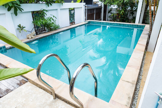 Cloudy swimming pool water after added chlorine powder, poor water quality, swimming pool need service and maintenance 