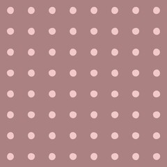 Soft pink polka dots pattern on a muted mauve background © Syaima Levantine