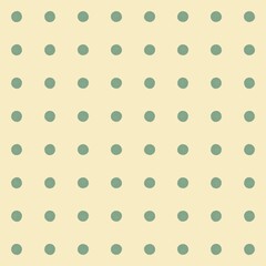 Subtle polka dot pattern on a soft yellow background for design © Syaima Levantine